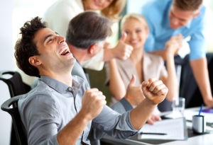 Guy Celebrating At Work - iStock_000022333352_Small